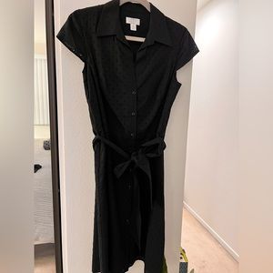 Black cotton eyelet pattern short sleeve button front knee length dress.